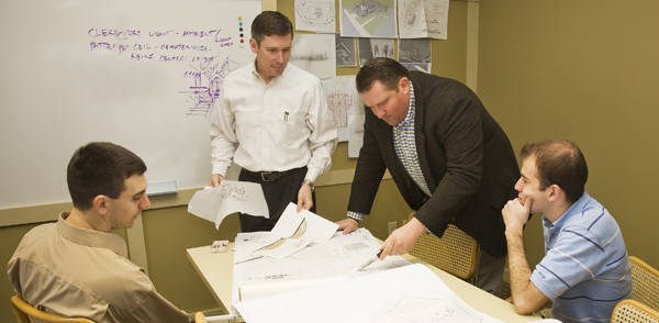 peter, john and staff reviewing plans